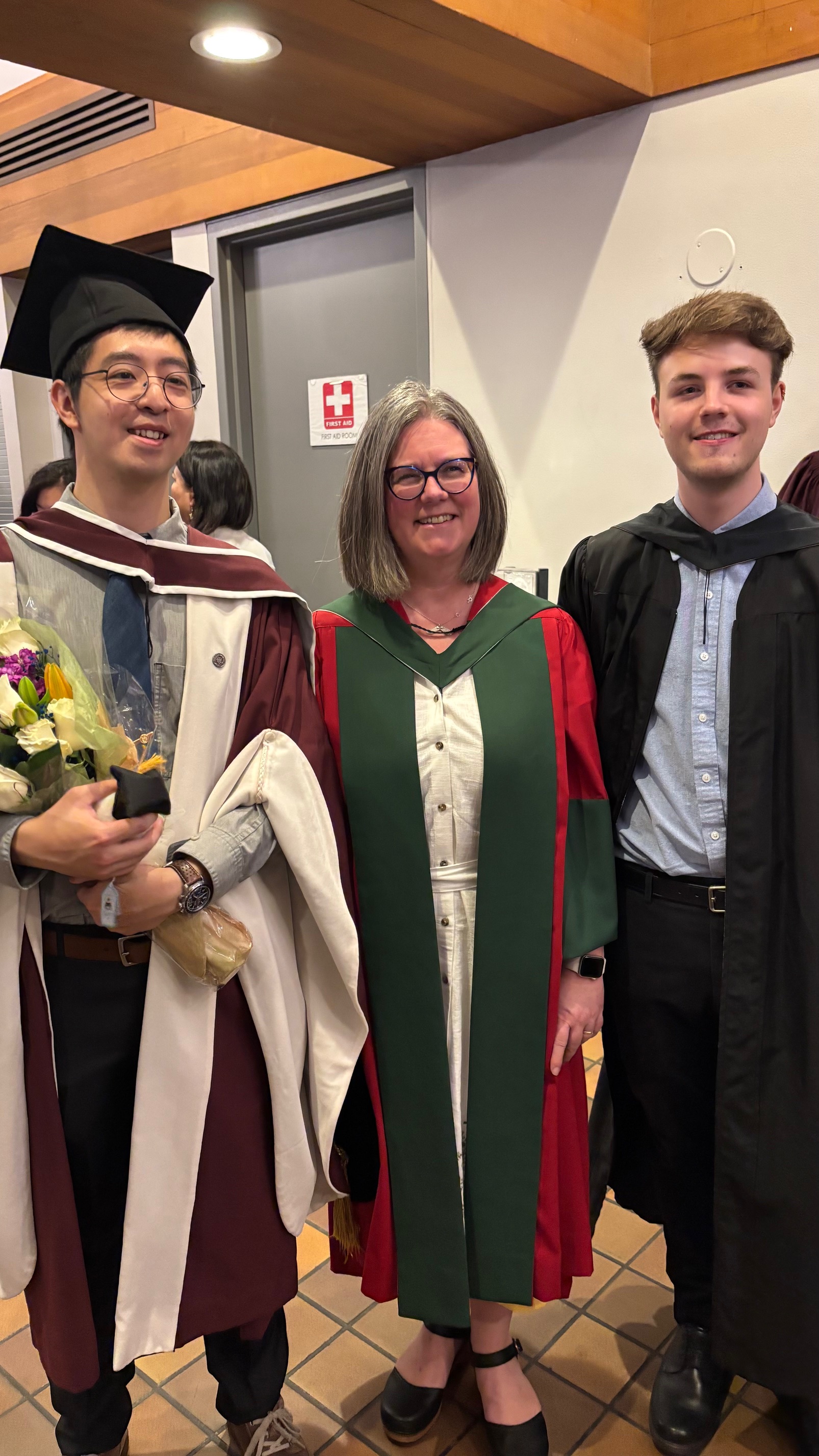 Cameron with the Goward group at graduation in 2025