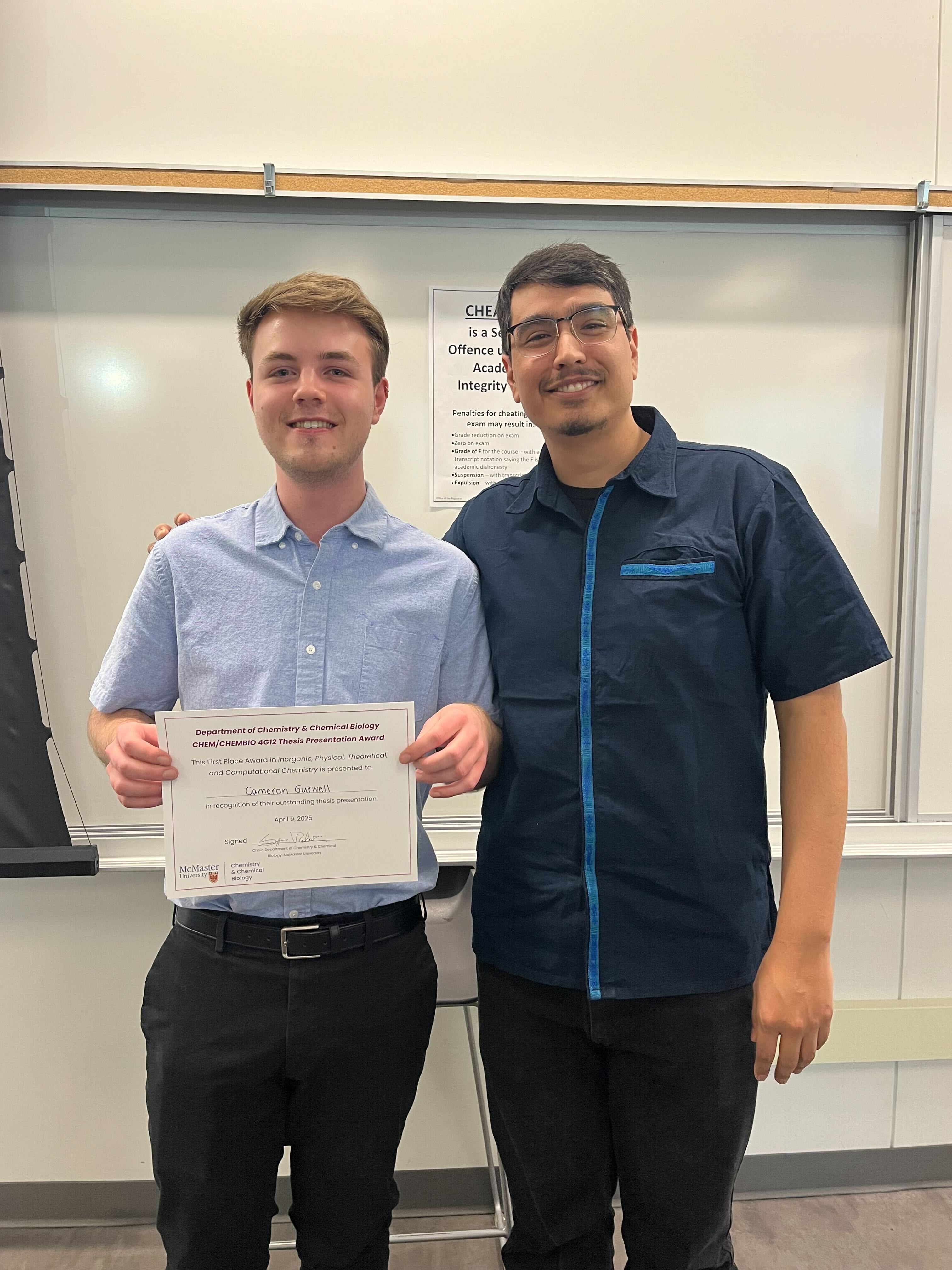 Cameron with his undergraduate thesis award in 2025
